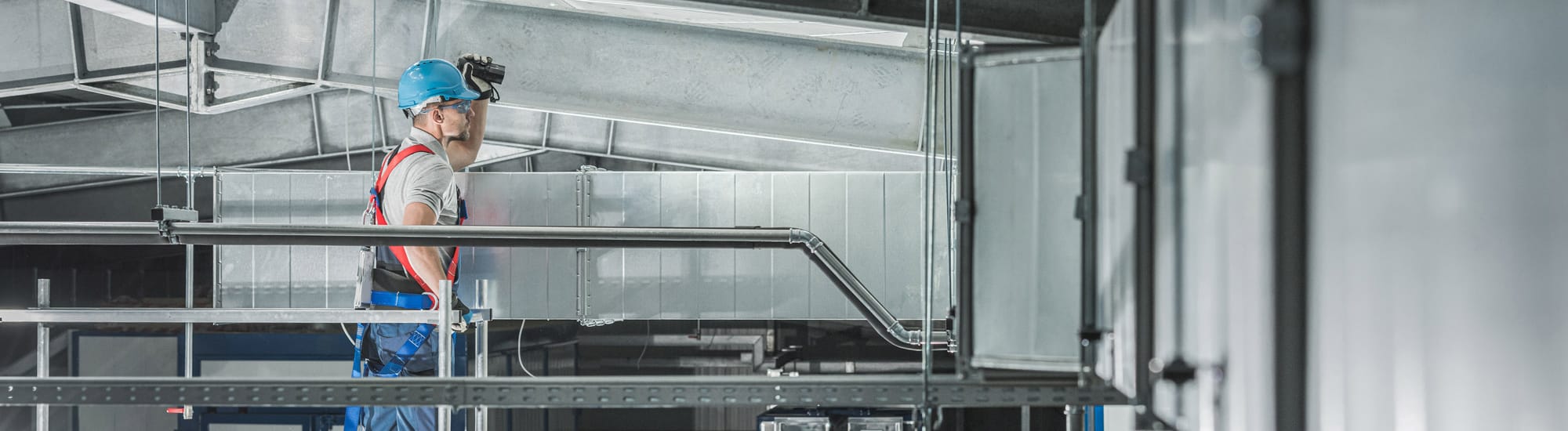 HVAC System is inspected by worker