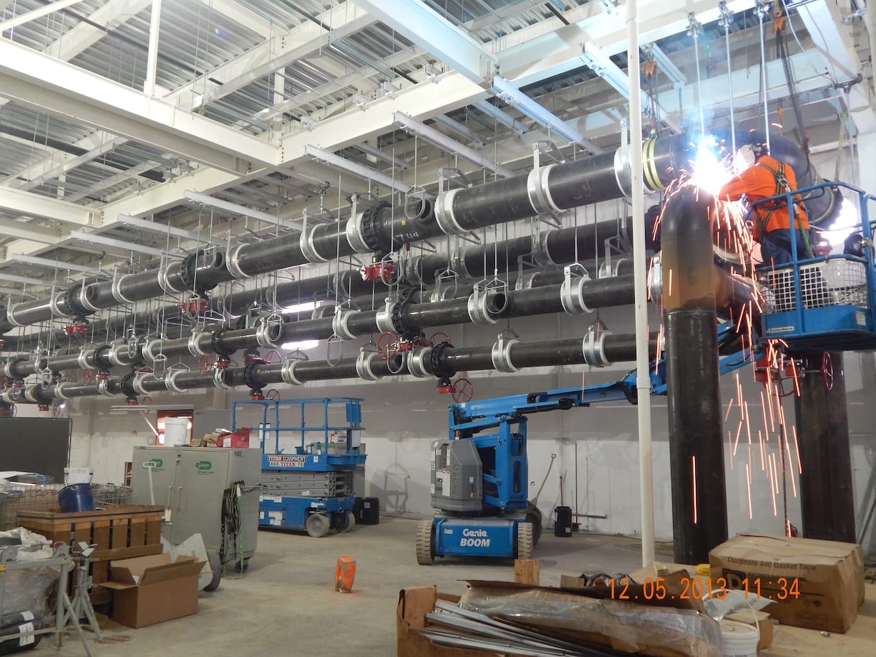 Pipes being welded as part of new delivery system