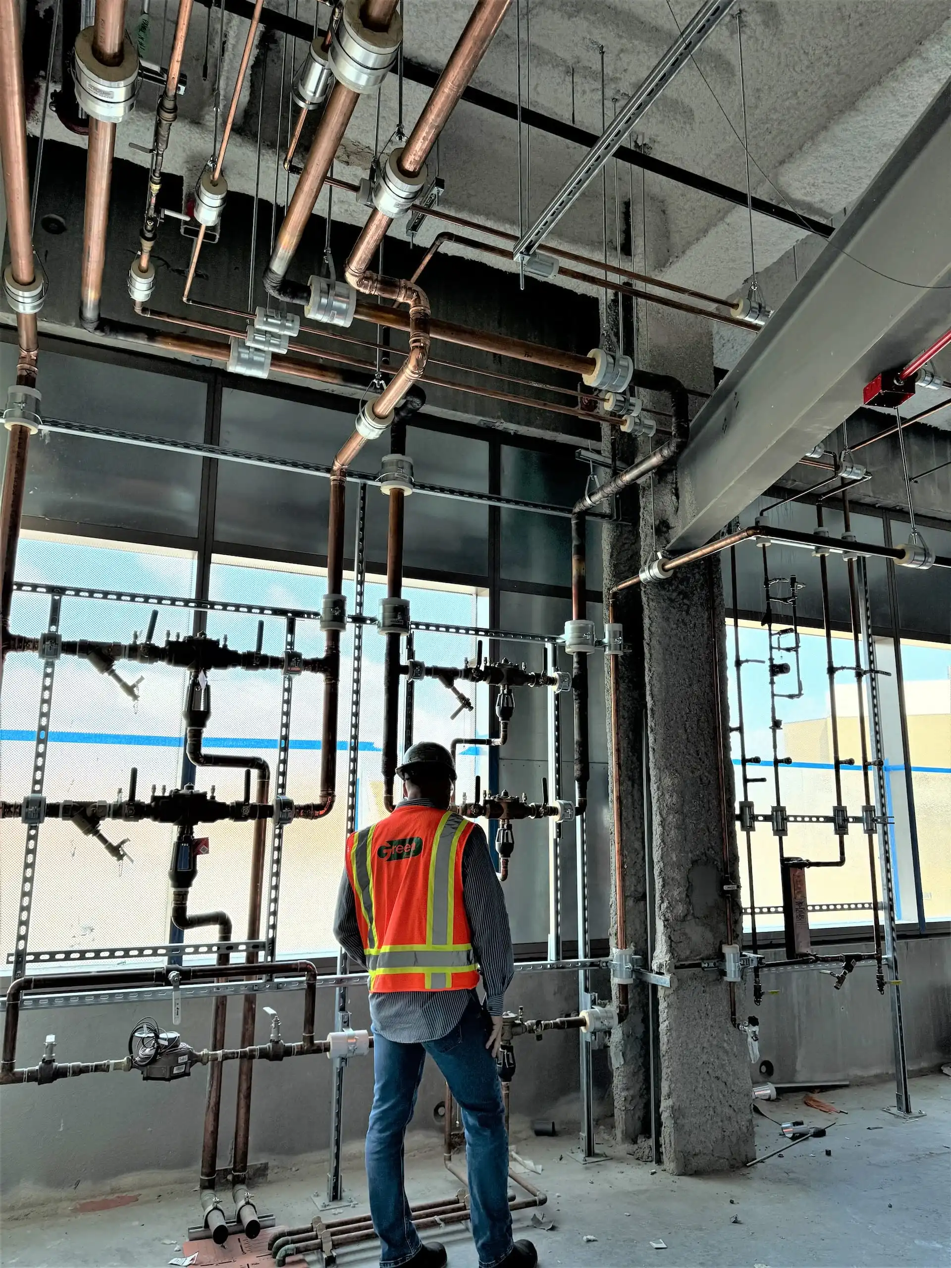 Worker installs Pipping system